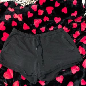 Pink Victoria Secret black shorts with white pink print.